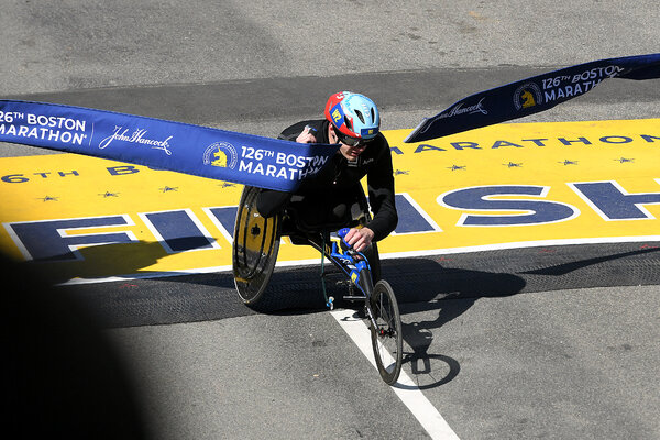 Daniel Romanchuk of the United States crosses the line to win the men's wheelchair race on Monday.